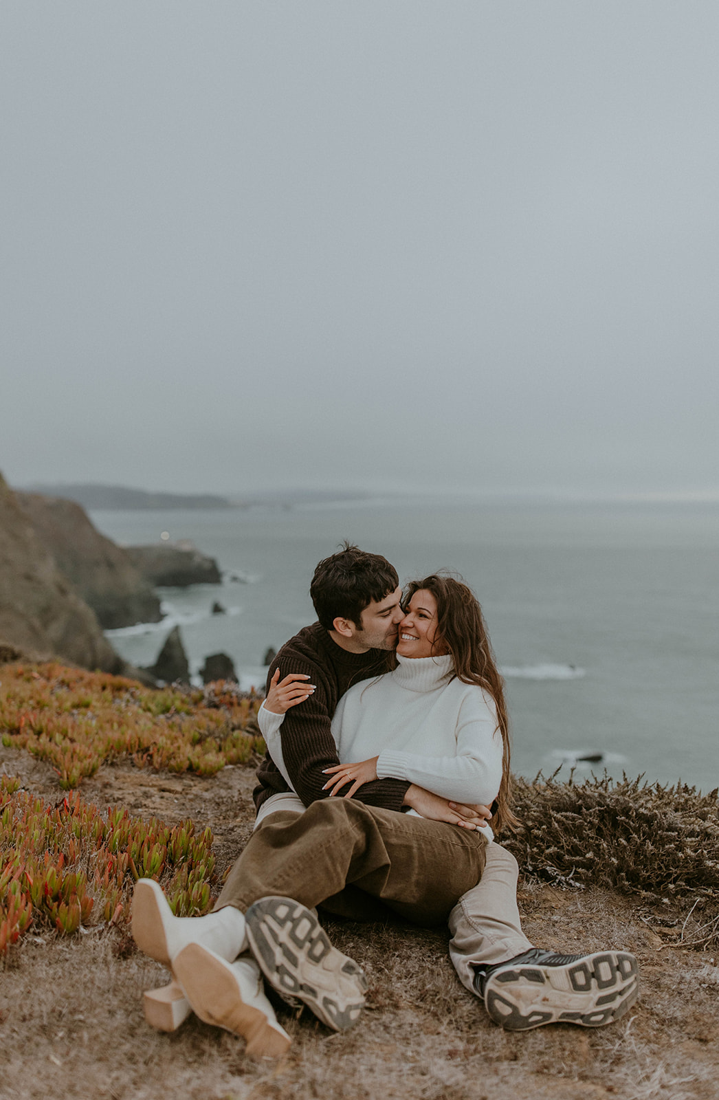 cute poses for engagement photos, winter engagement photos, beach engagement photos, winter engagement photo outfits. Photo taken by Codi Baer Photography 
