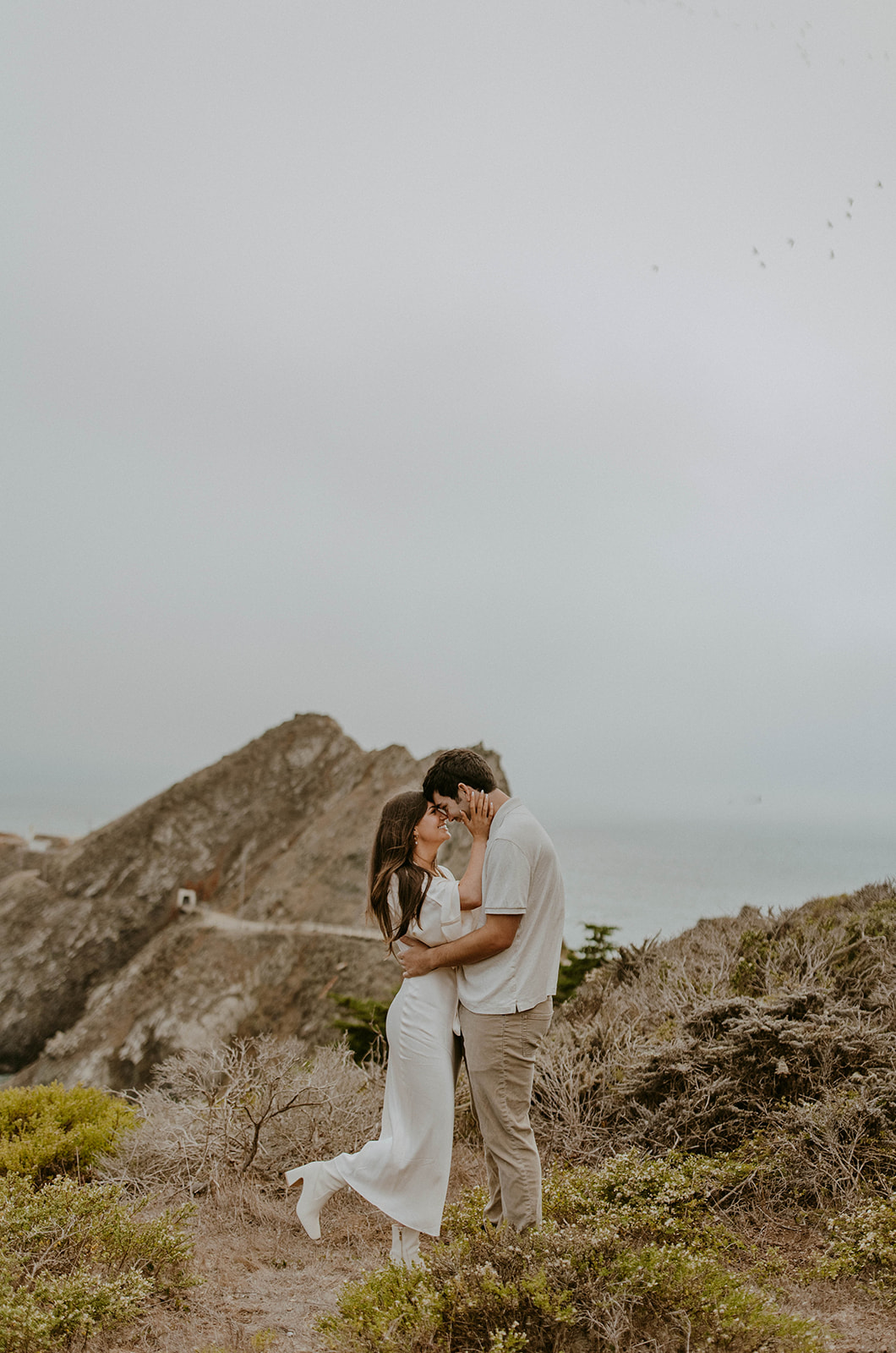 coastal beach engagement photos in the fall. Photo taken by Codi Baer Photography. 