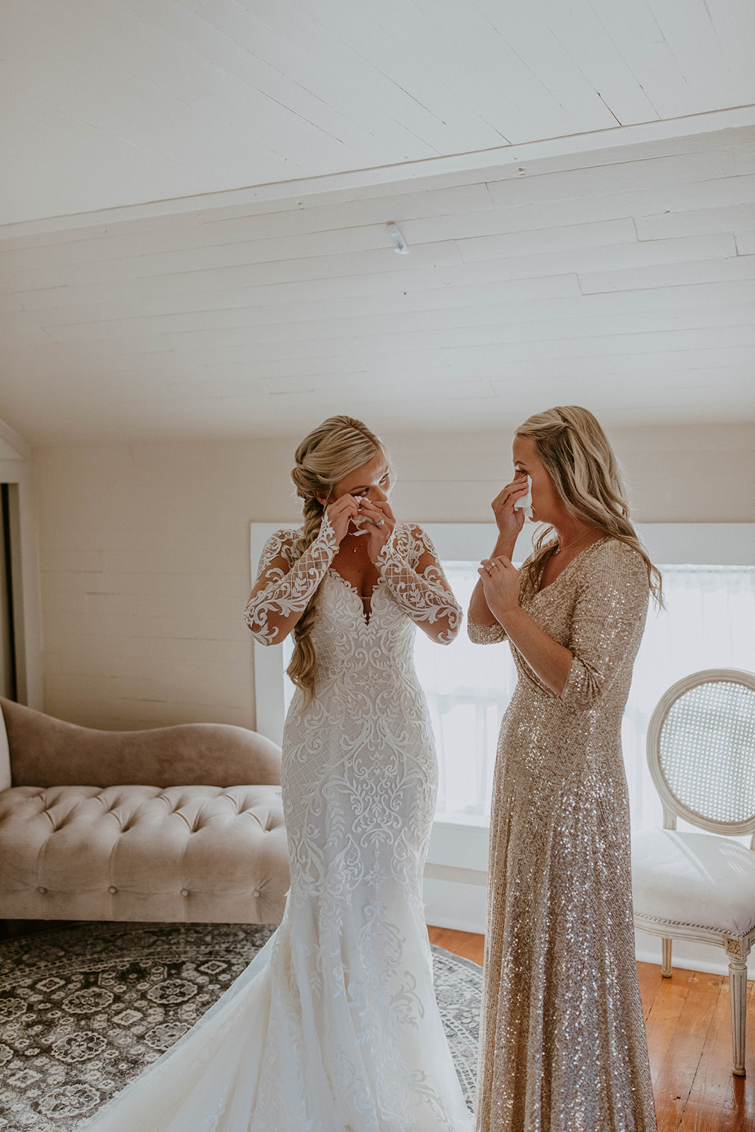mom and daughter cry when seeing each other on her wedding day. photo by codi baer photography