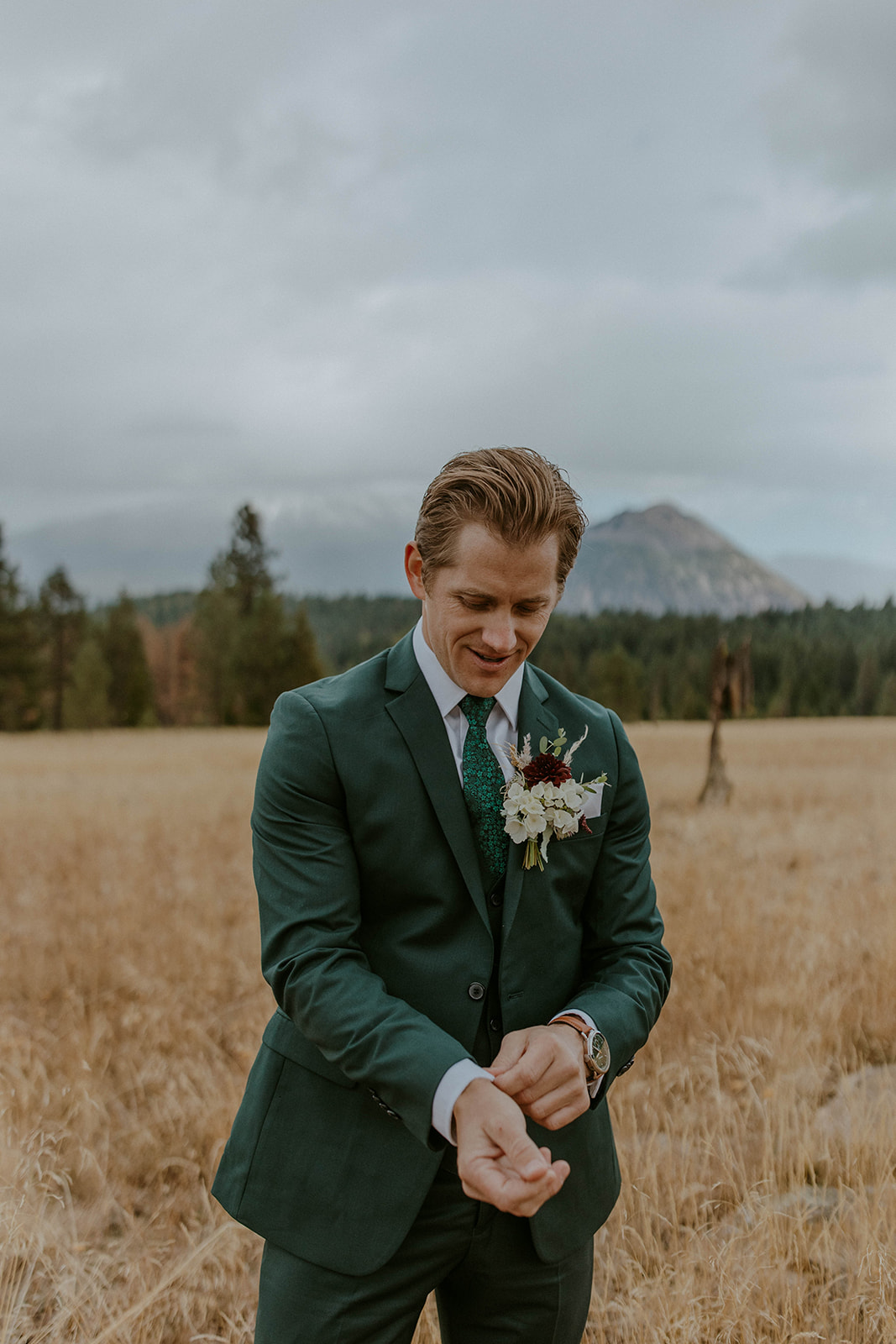 groom wears a hunter green suit for a fall wedding in northern california 